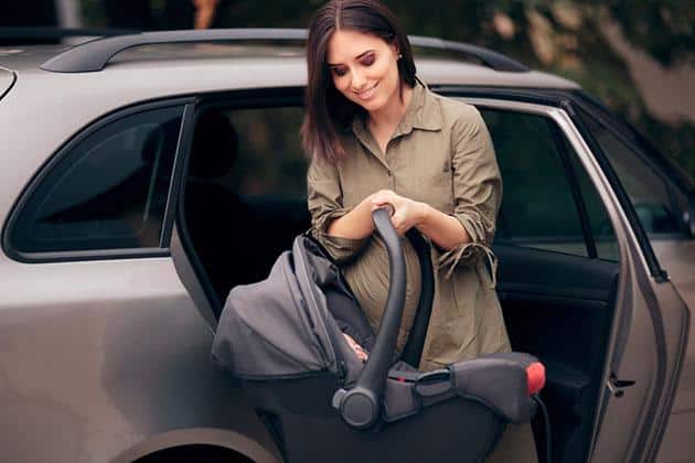 how to put newborn in car seat