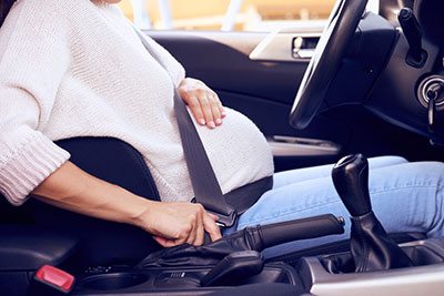injuries caused to pregnant women car crashes seat belt design